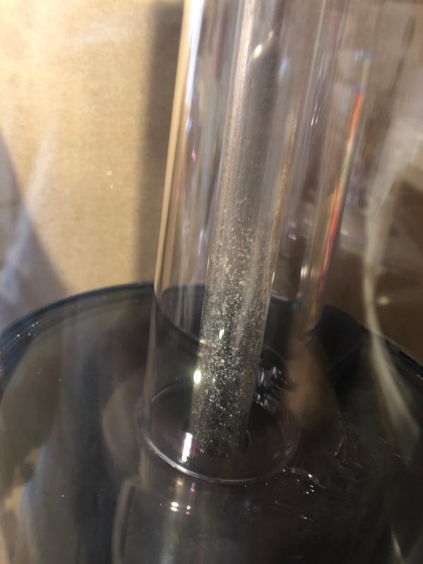 Inner tube of water reservoir. Mineral deposits that need descaling.