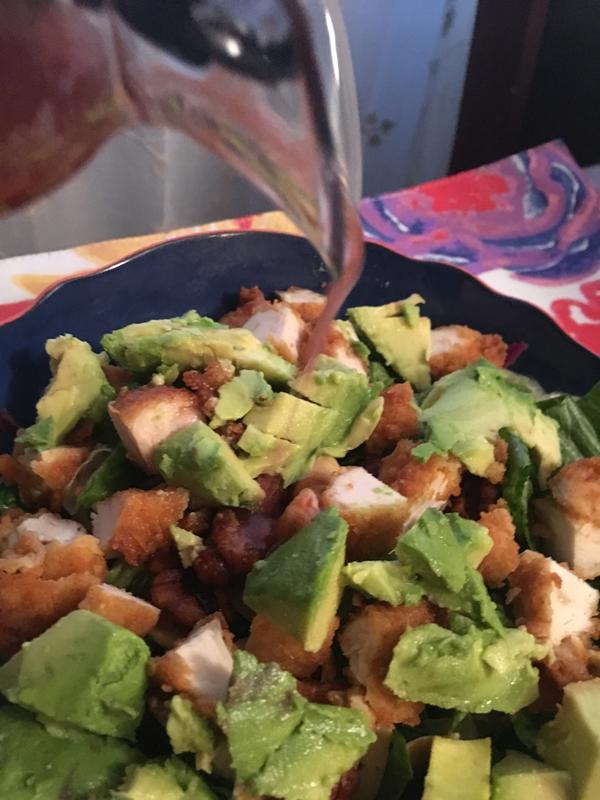 Love the pouring action going on. A perfectly dressed salad.