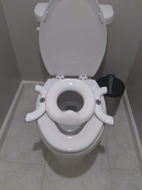 It rests flat on the toilet.