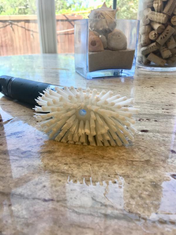 Hole in the center dispenses soap directly to cleaning surface.