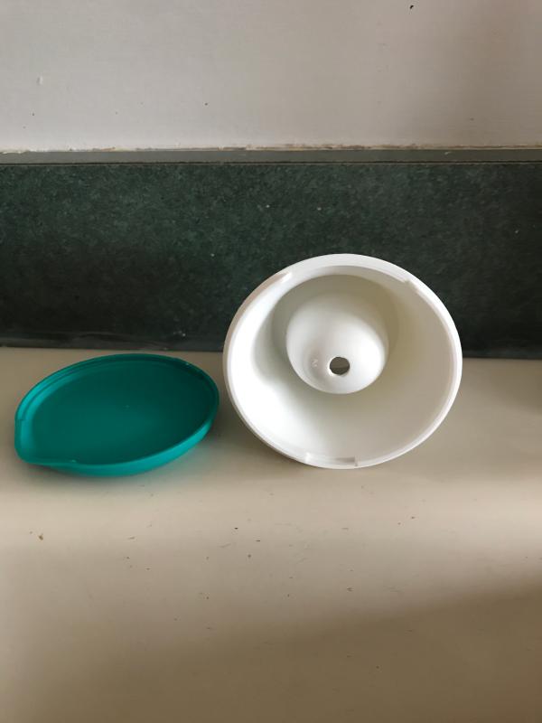 Brush drains into here and you can remove, drain and clean it
