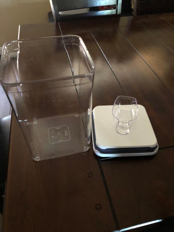 Container with built in scoop and holder