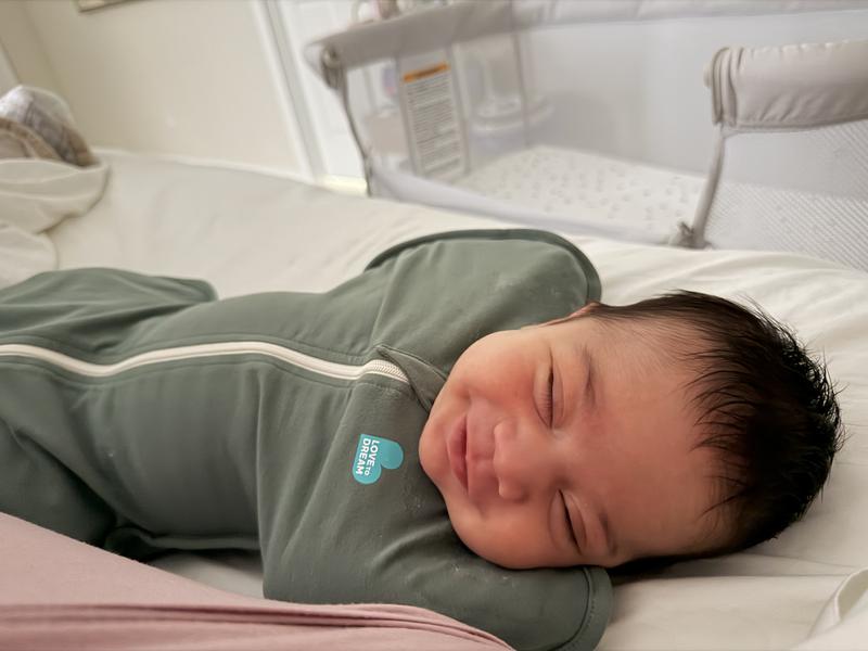 Customer photo for "My son adores it. Better than any swaddle"