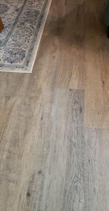 Style Selections Style Selection Urbanite Oak 8-mm T x 8-in W x 50-in L Water Resistant Wood Plank Laminate Flooring (23.92-sq ft / Carton)