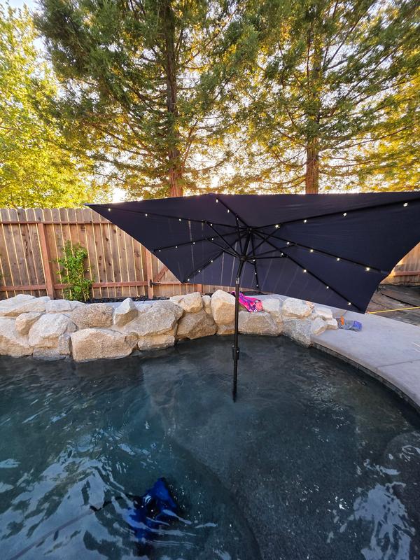 9 ft rectangular solar powered patio umbrella JZAC & QZYD 9x9 Cantilever with LED, Beige This umbrella has a square solar panel at the top Sun-Ray 9-ft Steel Beige Market