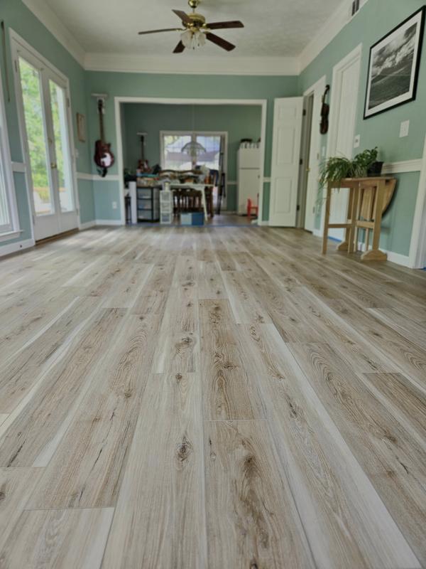 Style Selections Natural Hickory 7-in Wide x 5-1/2-mm Thick Waterproof Interlocking Luxury Vinyl Plank Flooring (18.62-sq ft) Style Selections Natural Hickory 7-in Wide x 5-1/2-mm Thick Waterproof Interlocking Luxury Vinyl Plank Flooring (18.62-sq ft)