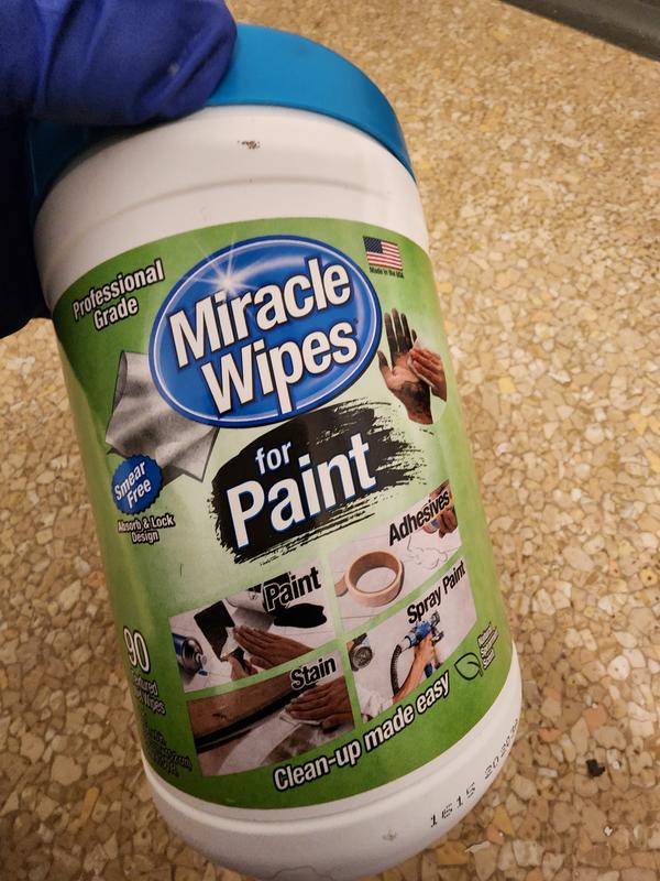 Cleaning wipes for adhesives