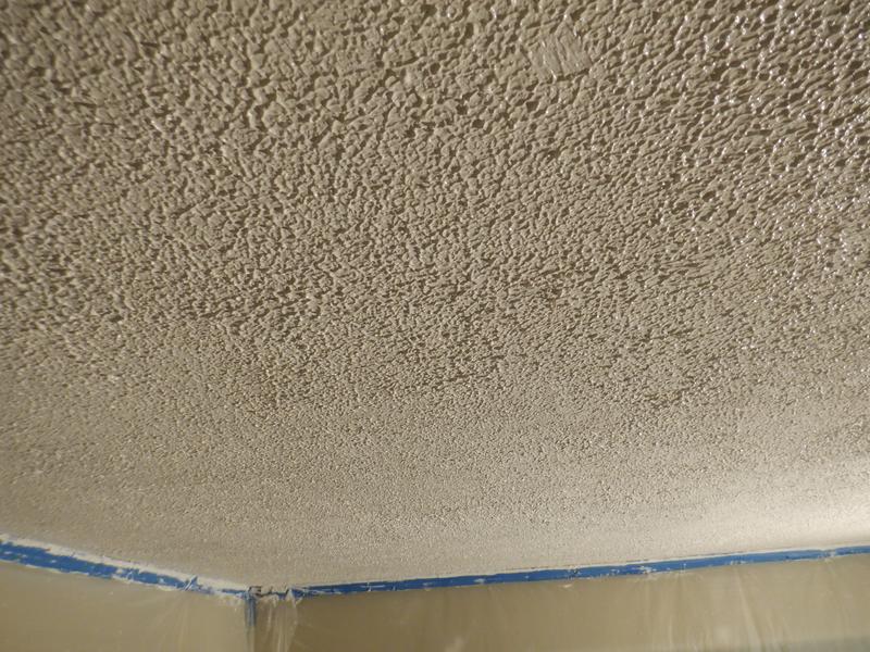Close-up Of Paint Roller Painting A White Wall. The Wall Has Popcorn Ceiling  Texture. Home Renovation Project Stock Photo, Picture and Royalty Free  Image. Image 150112458.