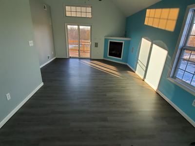 CoreLuxe 5mm w/pad Rivers Edge Oak Waterproof Rigid Vinyl Plank Flooring  5.75 in. Wide x 48 in. Long