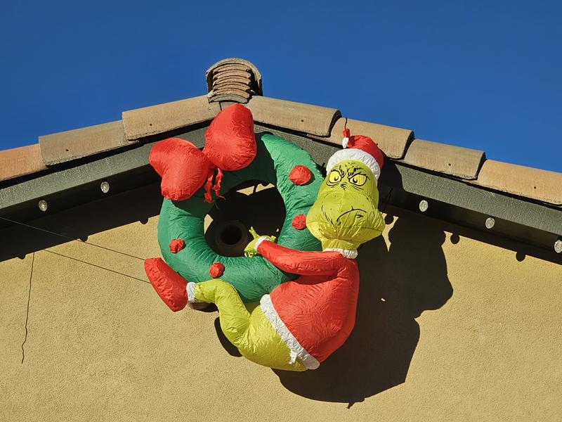 The factory Grinch airblown hanging wreath