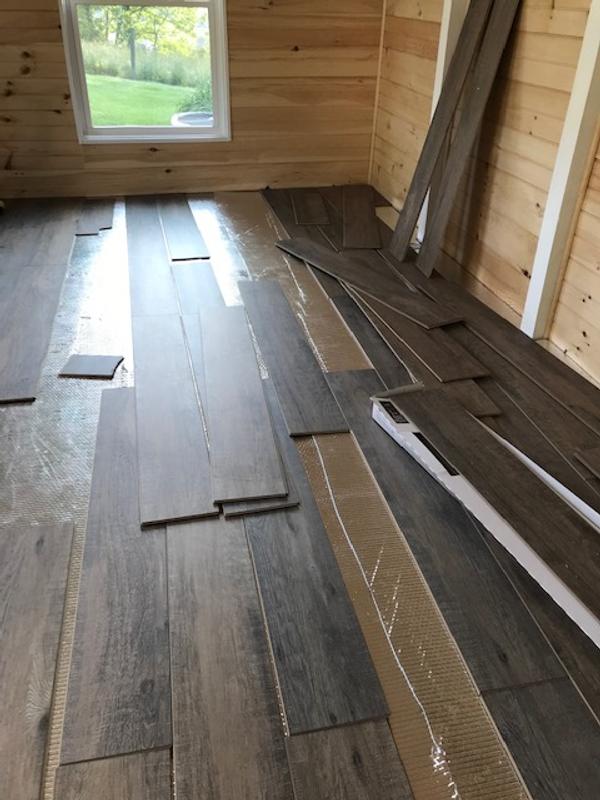 Style Selections Style Selection Urbanite Oak 8-mm T x 8-in W x 50-in L Water Resistant Wood Plank Laminate Flooring (23.92-sq ft / Carton)