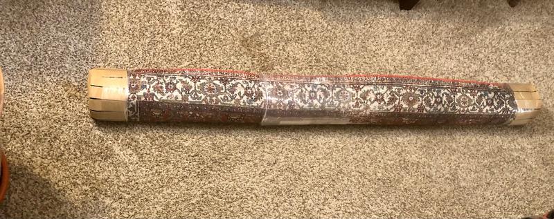 preparing to unroll the area rug