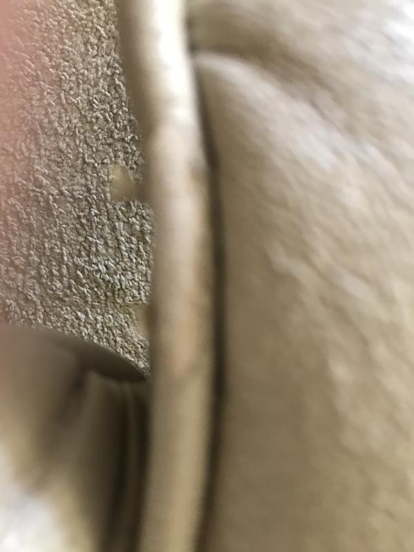 Ripped and peeling seam on seat of chair