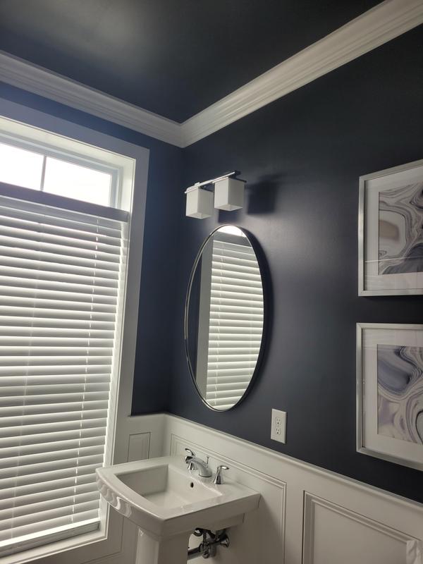 Completes the bath remodel. Looks great and provides plenty of light for a dark color paint.