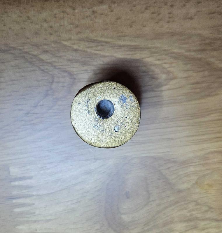 Top nut not centered.