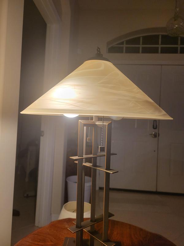 Bulbs visible below the shade, detract from the attractiveness & decent construction of the lamp.