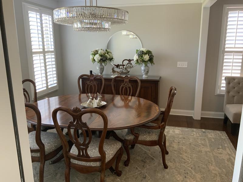 A vision of beauty, reflecting light and making this medium-sized dining area feel very spacious.