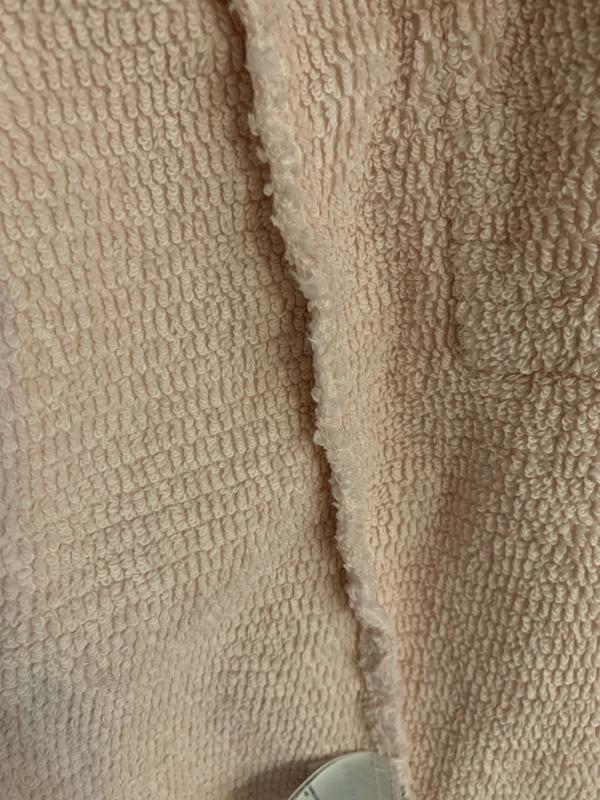 Inside of pink robe.