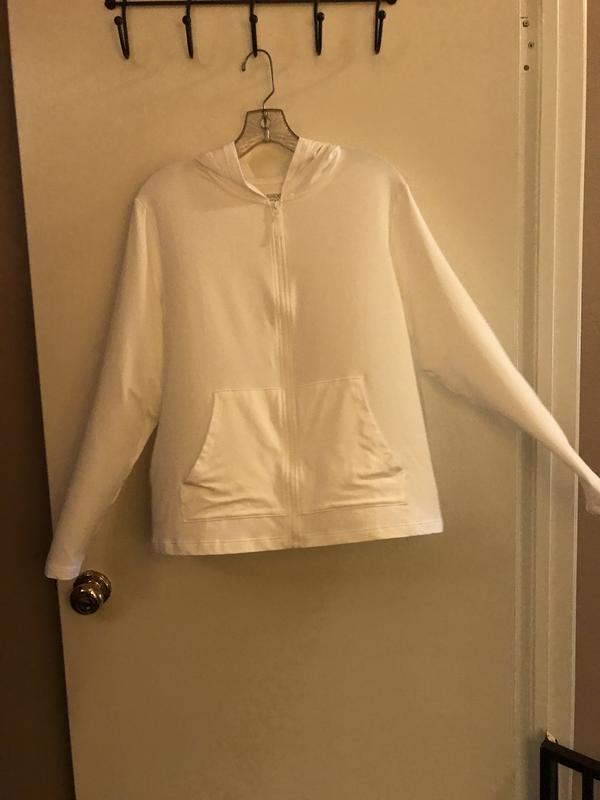 After wash, air drying white rush guard jacket, trying to eliminate the strong chemical like odor.