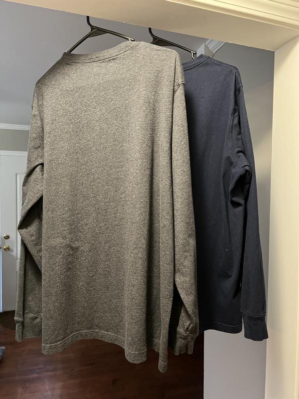 The navy shirt is now smaller than the grey one, after two launderings.