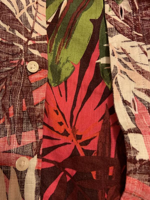 buttons sewn on the wrong side of the printed material