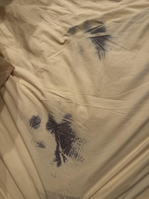 Stains left on bed from sitting in two different spots
