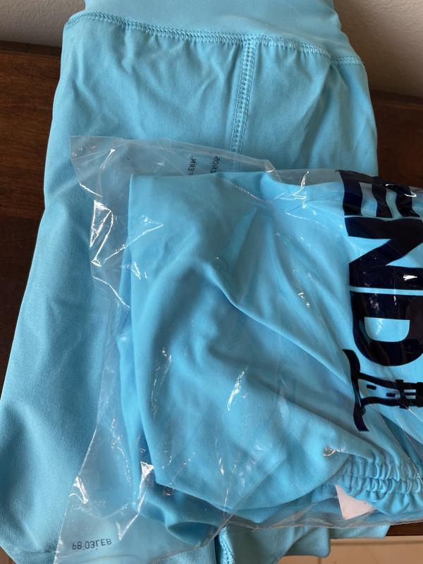 Washed out color of swim shorts worn once and new Tankini top that is much brighter and deeper color