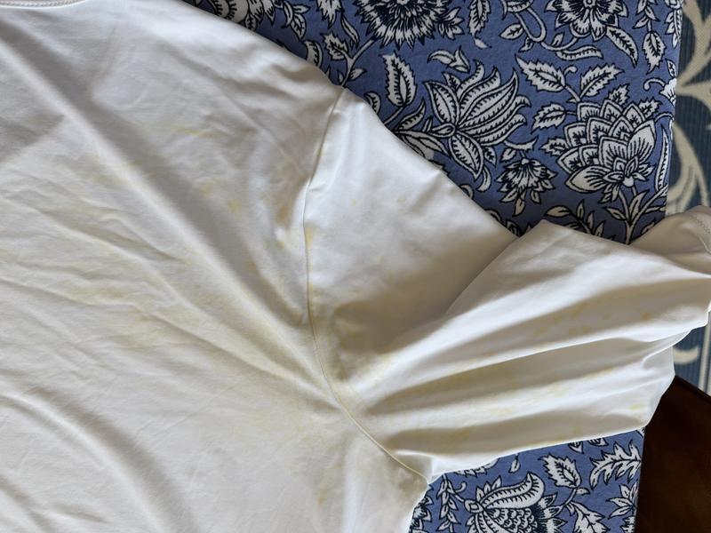 Closeup of olive dye that ran onto my white LandsEnd UPF shirt