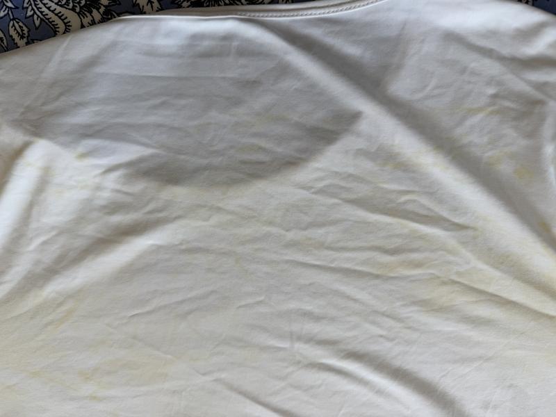 Closeup of olive dye that ran onto my white LandsEnd UPF shirt