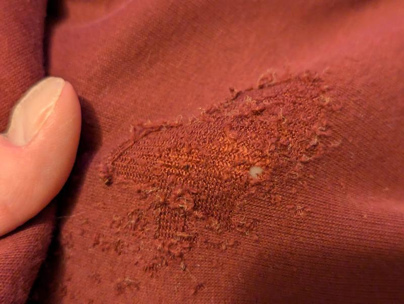 Fabric is so thin it's forming a hole.