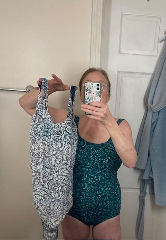 Wearing the new; holding the 30-day old identical suit!