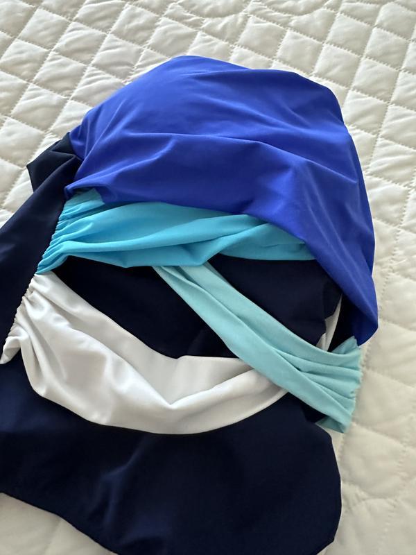 None of the color bands are sewn in place. It does look good when it is on, at least when its new.