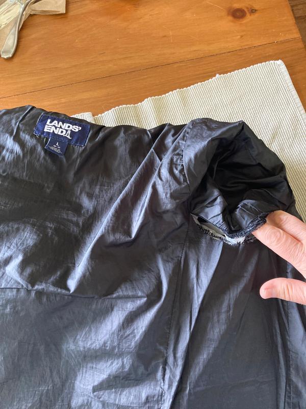 Coat with rip...inner sleeve seam