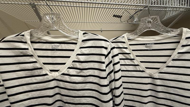 Neck trim is very puckered, and fabric shrunk 1" in sleeves and 1/2" in body length.