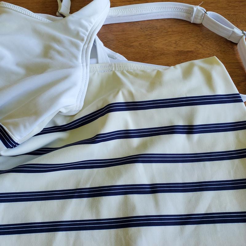 Worn once and turned yellow on the back.