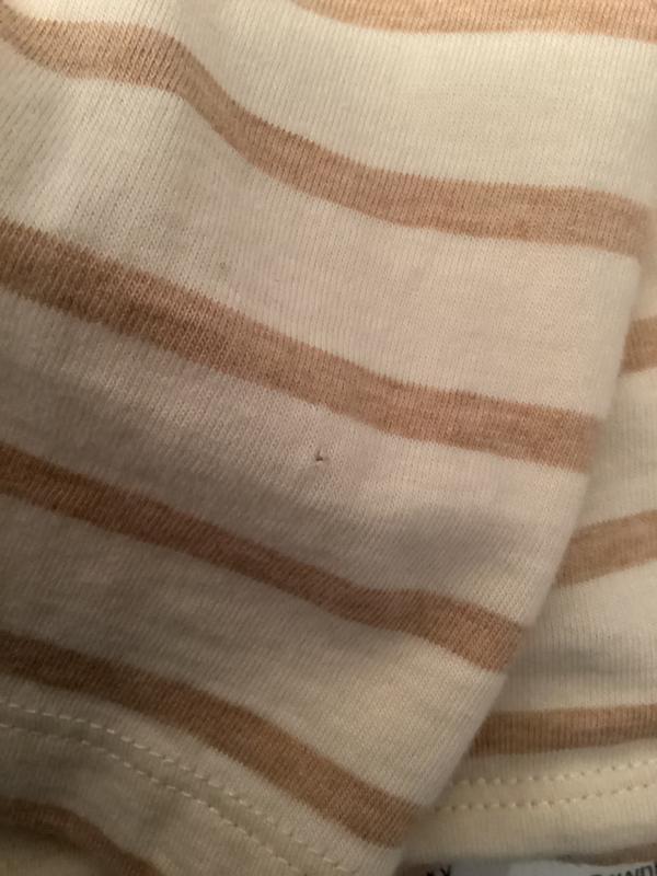 Hole in shirt sleeve after one wash