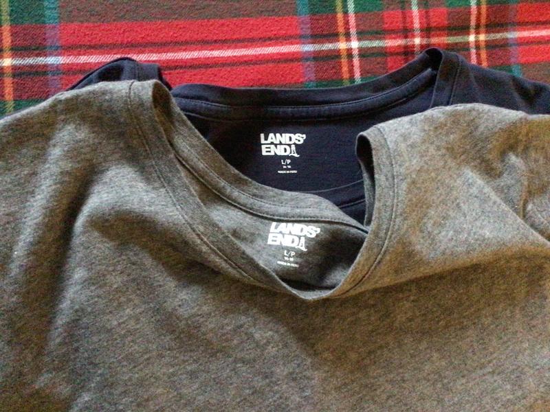 Navy shirt purchased about two years ago vs recent purchase of gray.
