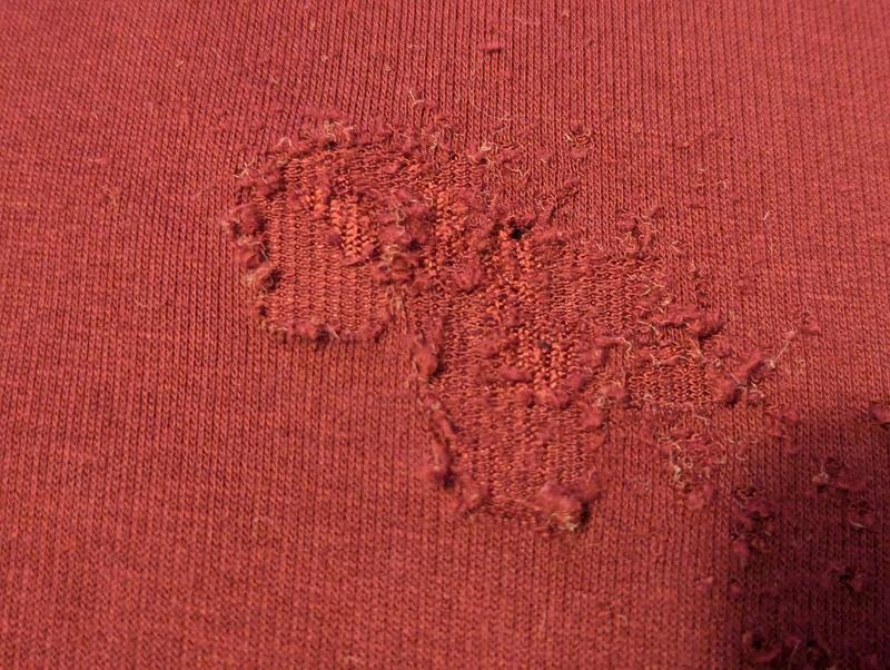 Fabric is thinning and pilling away.
