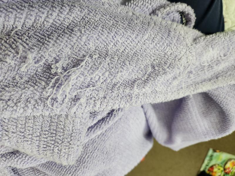 Frayed threads on lapel