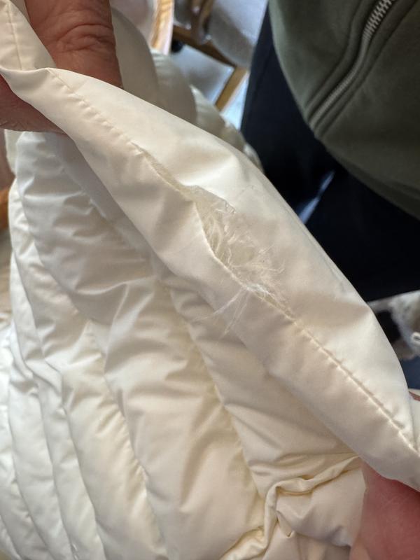 tear in the bottom hem seam