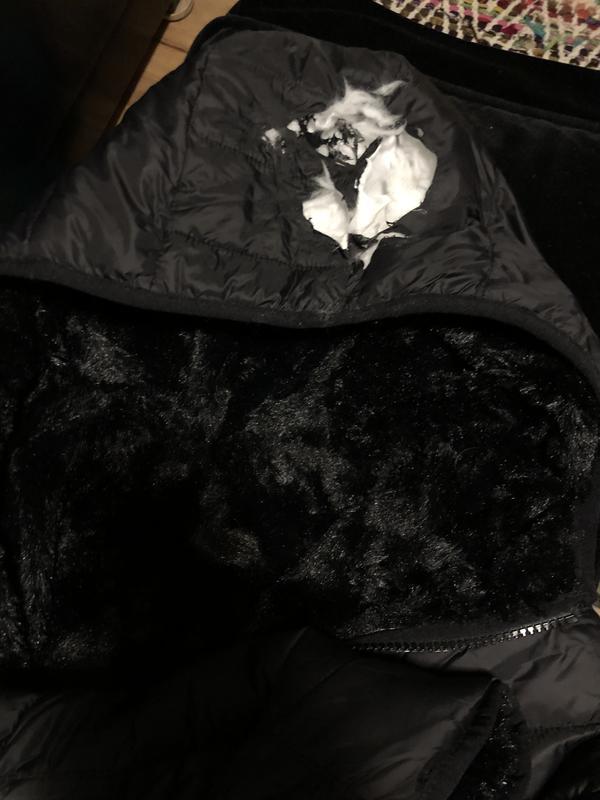 Hood melted when 5 year old stood next to a warm fireplace.