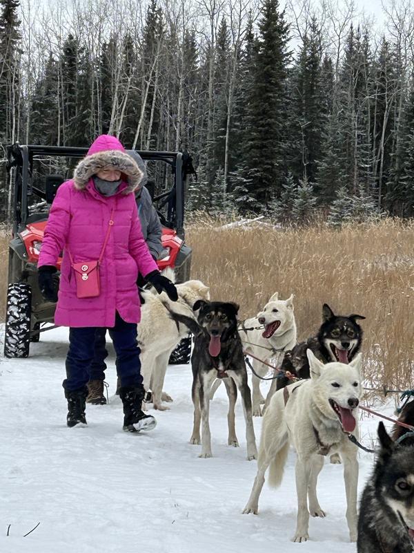 Perfectly warm sled ride in pink jacket