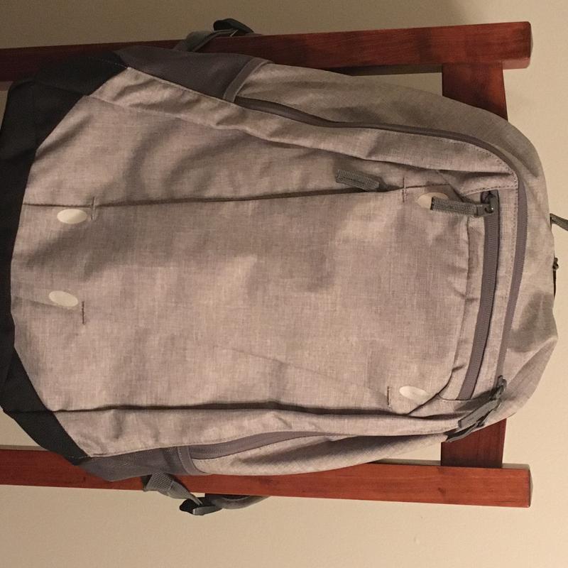 Daylight view of iron-on Lightweight reflective strips blending in with the gray fabric