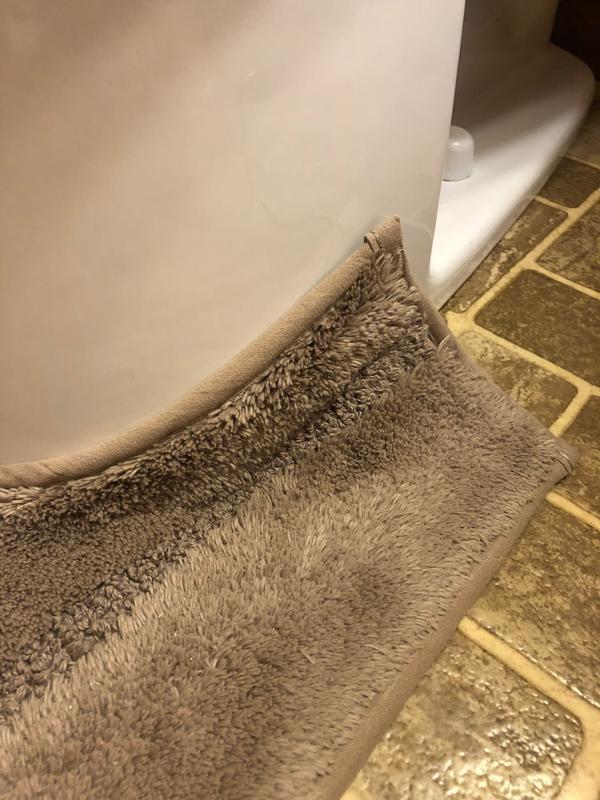 New Land's End mat showing how the cutout for the toilet is too small.