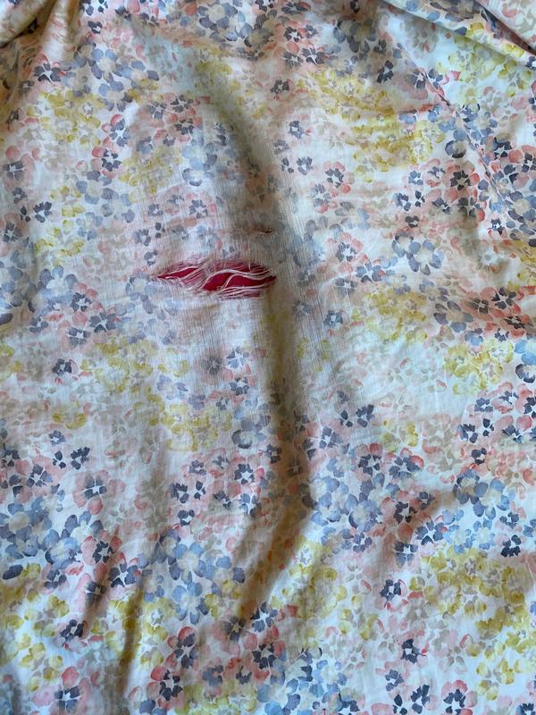 Faded, worn, ripped spots