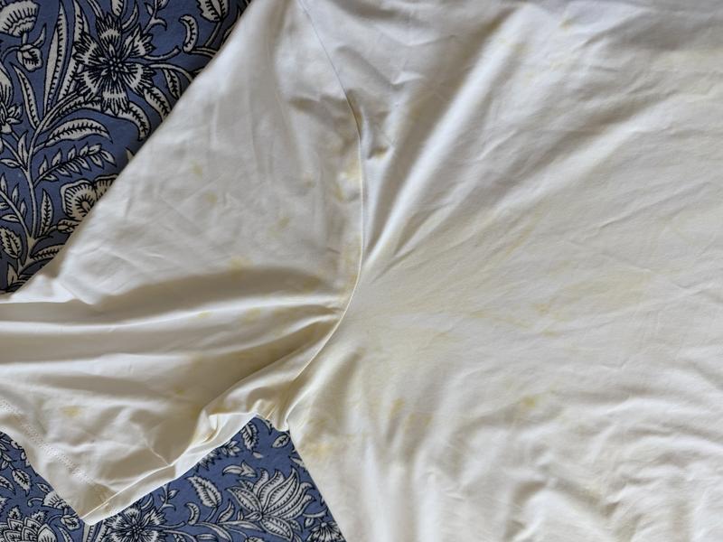 Closeup of olive dye that ran onto my white LandsEnd UPF shirt