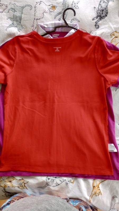 Another LE shirt on top of polo shirt of the same size