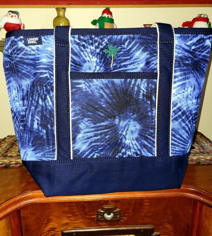 Size medium with added palm tree embroidery.