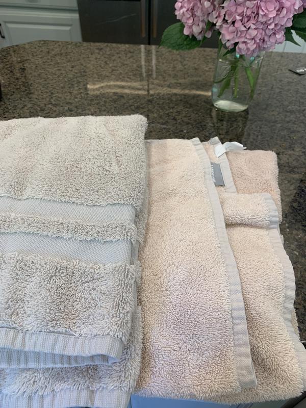Hand towel on left; bath on right. Both “Cobblestone”