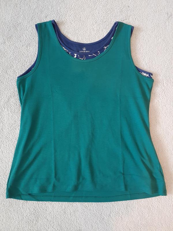 Skimpier 2020 green tank top versus the 2018 printed, navy blue tank top